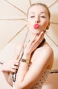 Beautiful sexi blonde pinup woman showing kiss Royalty Free Stock Photo