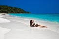 Beautiful bikini girl model sun tanned On Tropical Beach. O Royalty Free Stock Photo