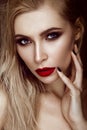 Beautiful blonde girl with sensual lips, fashion hair, black art nails. Beauty face. Royalty Free Stock Photo