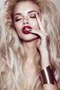 Beautiful blonde girl with sensual lips, fashion hair, black art nails. Beauty face.