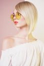 Sensual stylish woman in erotic white dress. Blue-eyed lady with perfect lips in modern colour sunglasses Royalty Free Stock Photo