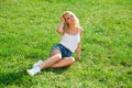 Beautiful blonde woman in blue jeans shorts Royalty Free Stock Photo