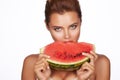 Beautiful brunette woman eating watermelon on a white background, healthy food, tasty food, organic