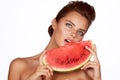 Beautiful brunette woman eating watermelon on a white background, healthy food, tasty food, organic