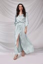 Beautiful sexy brunette woman wear summer collection dress style cruise collection fashion model silk textile elegant clothes Royalty Free Stock Photo