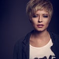 Beautiful cocky woman with short bob blond hairstyle in fas