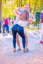 A beautiful sexy couple dancing in a city park