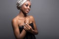 Beautiful girl black woman with make-up and a scarf on his head in the studio