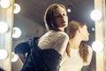 Beautiful girl near the mirror in the dressing room in a je Royalty Free Stock Photo