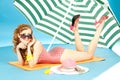 Beautiful girl pin up in a bright bikini resting. Royalty Free Stock Photo
