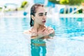 Beautiful sexy girl relaxing in a pool at summer Royalty Free Stock Photo