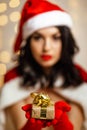 Beautiful sexy girl wearing santa claus clothes with christmas gift Royalty Free Stock Photo