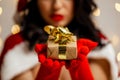 Beautiful sexy girl wearing santa claus clothes with christmas gift Royalty Free Stock Photo