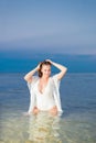 Beautiful girl in a white bathing suit and tunic Royalty Free Stock Photo