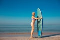 Beautiful surfer girl on the beach Royalty Free Stock Photo