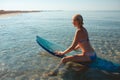 Beautiful surfer girl on the beach Royalty Free Stock Photo