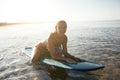 Beautiful surfer girl on the beach Royalty Free Stock Photo