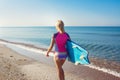 Beautiful surfer girl on the beach Royalty Free Stock Photo