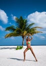 Beautiful sexy tanned woman in bikini on Maldives island. Young glamour girl in swimsuit on Maldives beach. Perfect body bikini Royalty Free Stock Photo