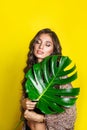 Beautiful indian woman in bikini with tropical plants. Beauty, fashion. Spa, healthcare. Tropical vacation. Royalty Free Stock Photo