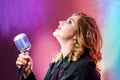 Beautiful woman singing with the microphone Royalty Free Stock Photo