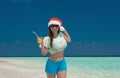 Maldives,  woman Christmas hat, landscape Royalty Free Stock Photo