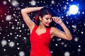Beautiful woman in red dancing at nightclub Royalty Free Stock Photo