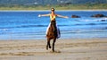 Beautiful sexy woman riding a horse at Tamarindo Beach Costa Rica