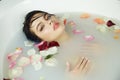 Beautiful woman takes bath rose candles Valentine's day spa Royalty Free Stock Photo