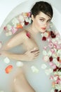 Beautiful woman takes bath rose candles Valentine's day spa Royalty Free Stock Photo