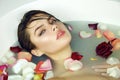 Beautiful woman takes bath rose candles Valentine's day spa Royalty Free Stock Photo