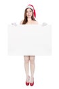 Beautiful woman wearing santa claus clothes with blank sign Royalty Free Stock Photo