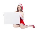 Beautiful woman wearing santa claus clothes with blank sign Royalty Free Stock Photo