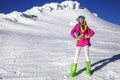 Beautiful sexy woman is wearing white fur, winter hat, scarf and winter boots. Attractive young girl in mountains Royalty Free Stock Photo