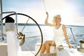 Beautiful young blonde woman, riding a boat on the water, itinerary, beautiful makeup, clothing, summer, sun, perfect body fi Royalty Free Stock Photo