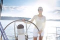 Beautiful young blonde woman, riding a boat on the water, itinerary, beautiful makeup, clothing, summer, sun, perfect body fi Royalty Free Stock Photo