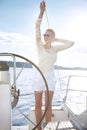 Beautiful young blonde woman, riding a boat on the water, itinerary, beautiful makeup, clothing, summer, sun, perfect body fi Royalty Free Stock Photo