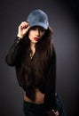Beautiful young make-up model in blue baseball cap with red Royalty Free Stock Photo
