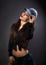 Beautiful young make-up model in blue baseball cap with red Royalty Free Stock Photo