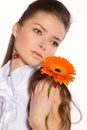 Beautiful young woman with gerber flower Royalty Free Stock Photo