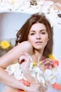 Beautiful young woman having bath with flower petals Royalty Free Stock Photo