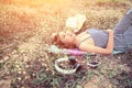 Beautiful young woman lying nearing headphone in the flower Royalty Free Stock Photo