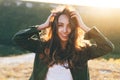 Beautiful sexy young woman smiling on beautiful landscape in sunset time. Royalty Free Stock Photo