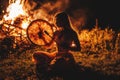 beautiful shamanic girl playing on shaman frame drum in the nature.