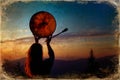 Beautiful shamanic girl playing on shaman frame drum in the nature, old photo effect. Royalty Free Stock Photo