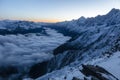 Beautiful sharp peaks start to shine as the sun rises in the French Alps