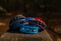 Beautiful, shiny, colorful bracelet set with large beadwork beads. On a wooden bench in the park. Jewelry on hand Royalty Free Stock Photo