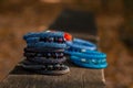 Beautiful, shiny, colorful bracelet set with large beadwork beads. On a wooden bench in the park. Jewelry on hand Royalty Free Stock Photo