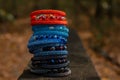 Beautiful, shiny, colorful bracelet set with large beadwork beads. On a wooden bench in the park. Jewelry on hand Royalty Free Stock Photo