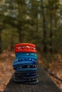 Beautiful, shiny, colorful bracelet set with large beadwork beads. On a wooden bench in the park. Jewelry on hand Royalty Free Stock Photo